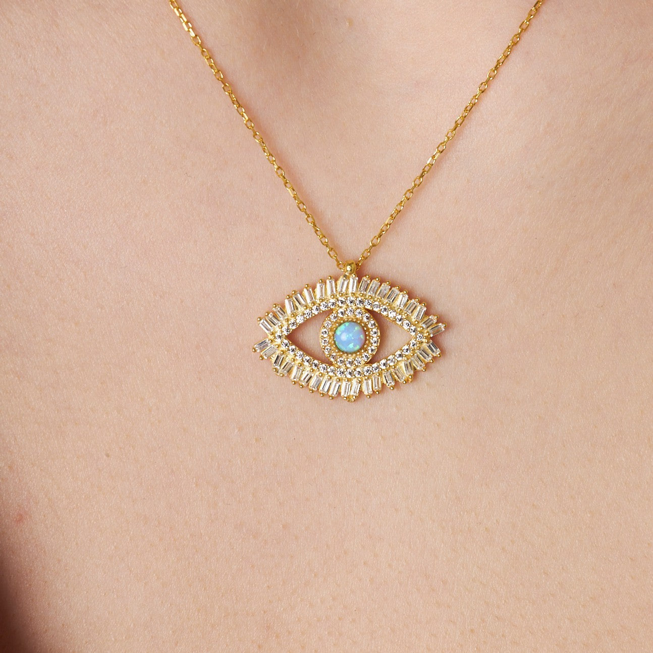 14K gold eye pendant necklace featuring baguette stones and an opal centerpiece, adjustable length 40+5 cm, elegant jewelry accessory.