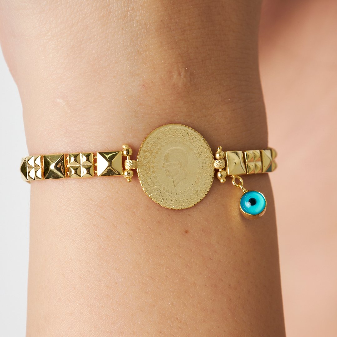 Quarter modern chain bracelet with evil eye