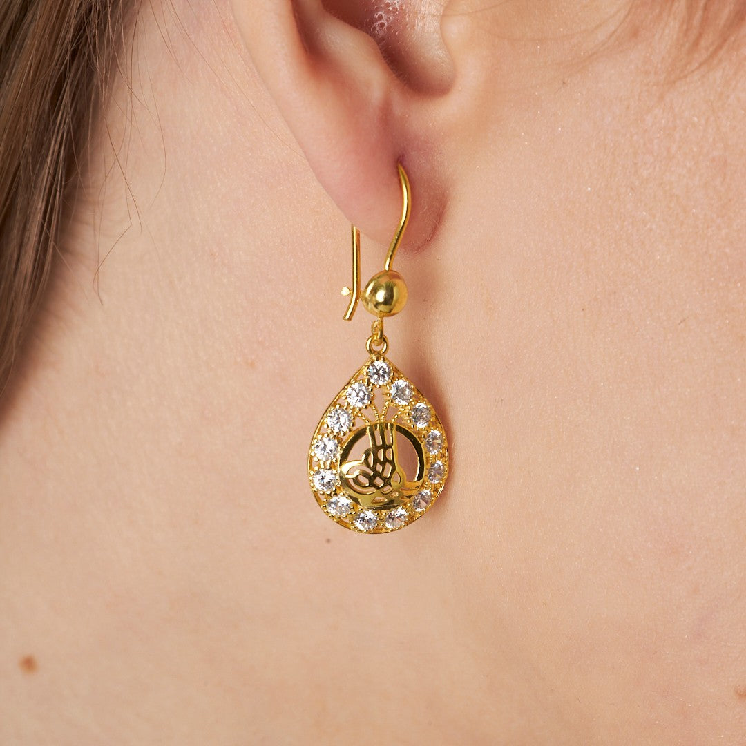 Earrings with monogram and stones