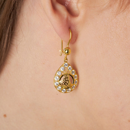 Earrings with monogram and stones