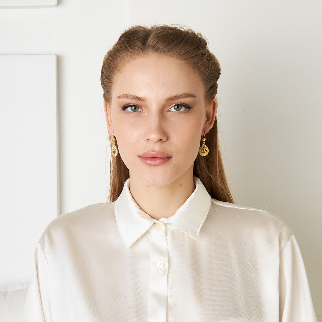 Earrings with monogram and stones